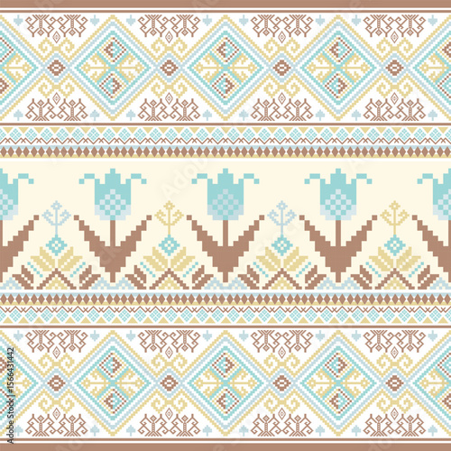 A light-toned pixel art pattern combining tribal elements and large stylized flowers, rendered in cream, blue, and brown tones.