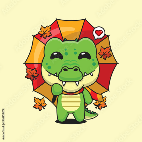 Cute crocodile holding umbrella in autumn day cartoon vector illustration