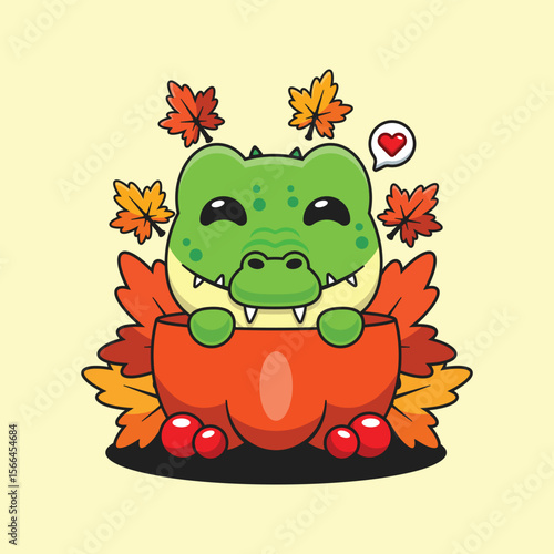 Cute crocodile in a pumpkin in autumn cartoon vector illustration