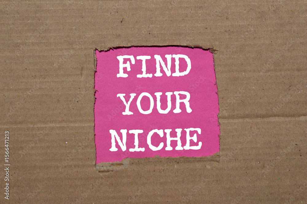 Obraz premium Find your niche message written on ripped torn cardboard paper on pink background. Conceptual find your niche symbol. Copy space.