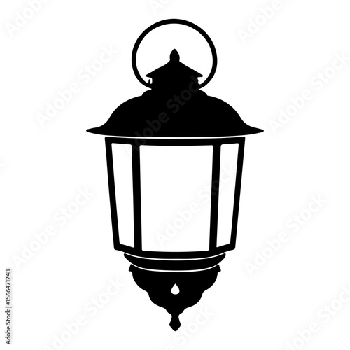 Silhouette of an ornate hanging lantern, a beacon in the darkness
