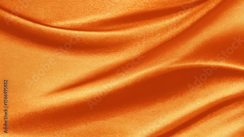 A close up shot of an orange satin fabric