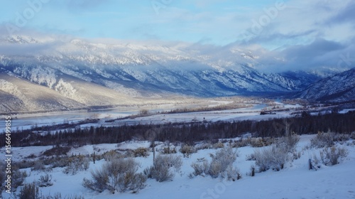 Wallpaper Mural A view of a snowy landscape with mountains in the background Torontodigital.ca