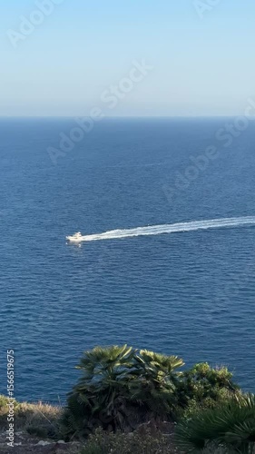 Speed Boat Cutting Through Calm Blue Sea Aerial View