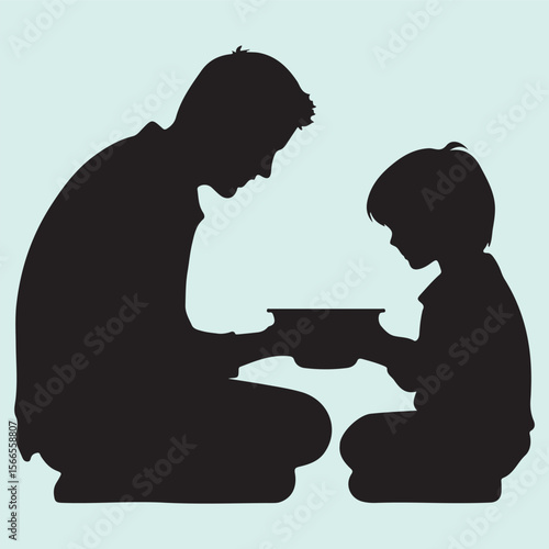 Silhouette icon of a parent feeding baby during mealtime