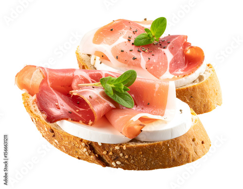 Two delectable bruschetta appetizers featuring thinly sliced prosciutto and fresh mozzarella cheese