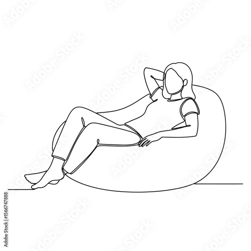 A woman is relaxing on a beanbag chair isolated on white background