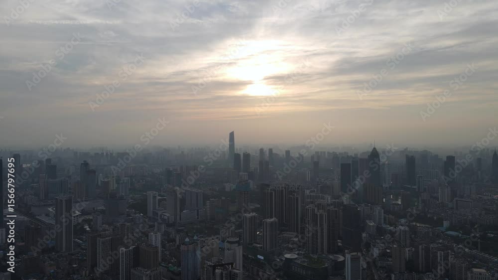 Stunning aerial view of city skyline during sunset over financial district with tall buildings and evening sky Stunning aerial view of city skyline during sunset over financial district with tall buildings and evening sky