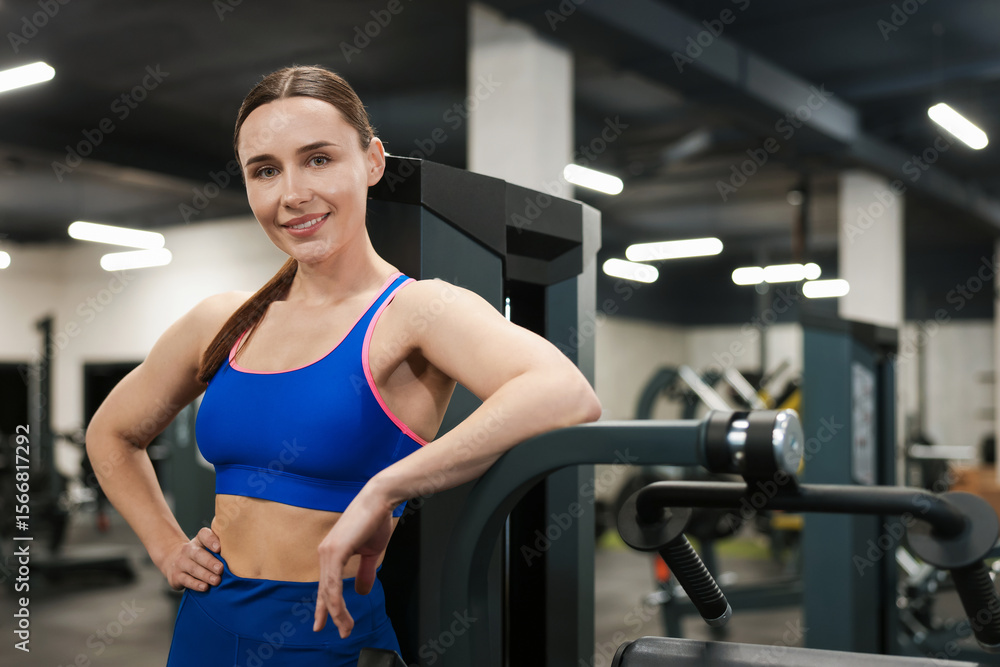 Obraz premium Portrait of professional personal trainer in gym. Space for text