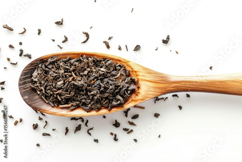 ultra HD image of dry tea in wood spoon on white white