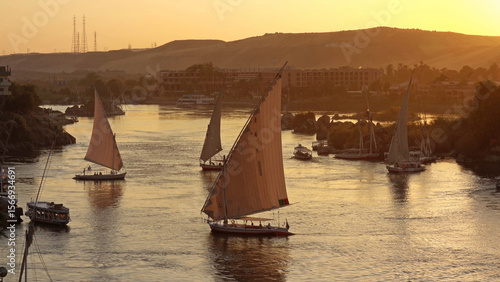 felucca boats on Nile river in Aswan at sunset
