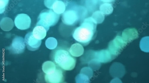 Bokeh particle light effect animation with teal background for your project