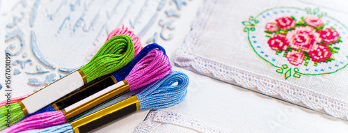 Threads for embroidery. Embroidered picture. Set for beading.