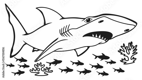 Hammerhead shark swimming amongst smaller fish and coral reef  