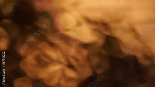 Abstract golden light leaks and bokeh effects creating a warm atmosphere