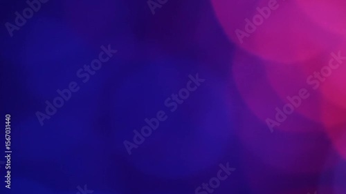 Abstract colorful bokeh background with blue and pink glowing light effect