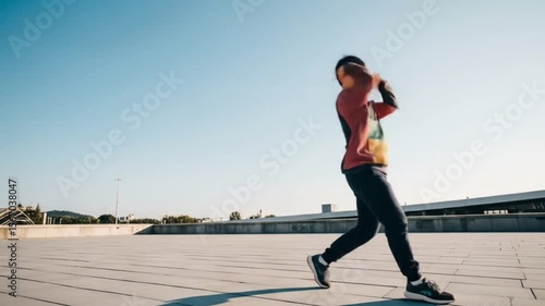 Urban Dancer Executes Dynamic Moves on Rooftop