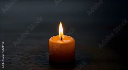 burning candle on a dark background