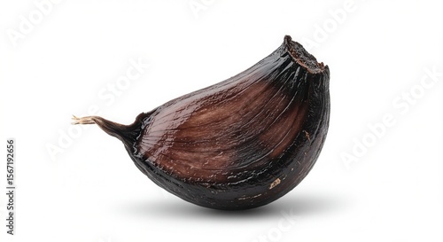 Wallpaper Mural A single clove of black garlic is isolated on white background Torontodigital.ca