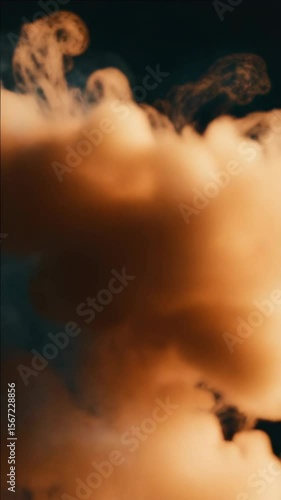 A cloud of smoke is shown in the . The smoke is orange and is in the air