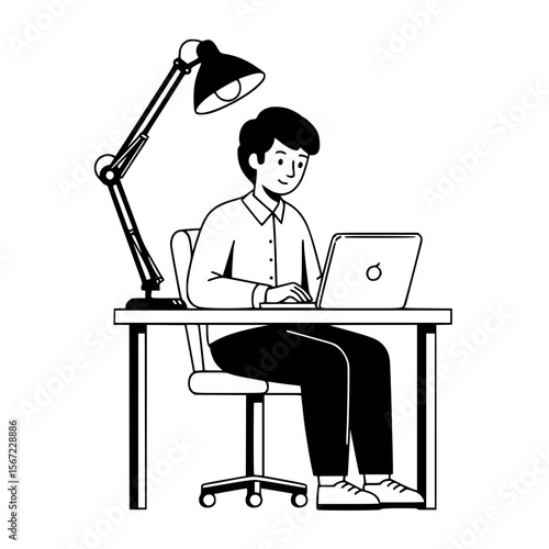 A person sits at a desk, working on a laptop under a lamp.