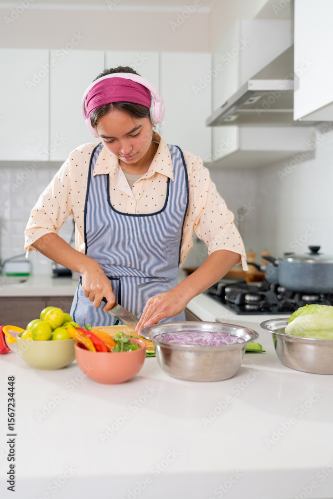 Young chef preparing ceviche, slicing ingredients in kitchen Young chef preparing ceviche, slicing ingredients in kitchen