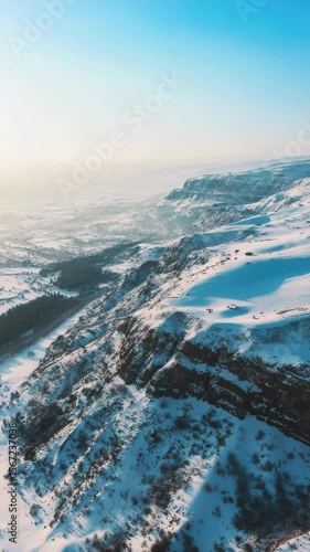 Wallpaper Mural Winter mountain top with snow-covered hills under clear skies. Torontodigital.ca