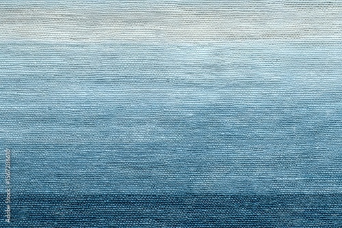 A captivating textured blue rug showcasing shades of color from the top to bottom. The rug's design will enhance interior decoration