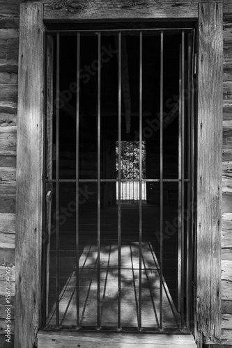 Obraz na plátně The historic Snodgrass cabin's front door and back door viewed through the secur