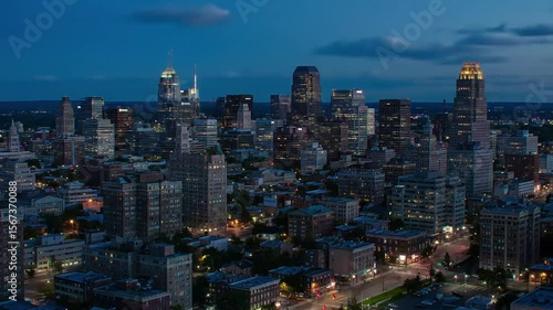 Wallpaper Mural An aerial twilight view of a dense city skyline, showcasing a variety of architectural styles from high-rises to smaller buildings.  Torontodigital.ca