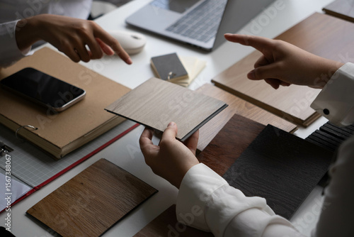 Two Interior Designers Collaborating in Office
