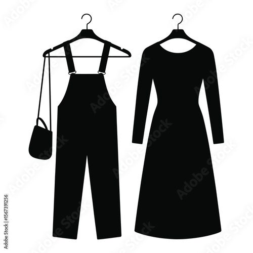 Black silhouette of overalls and a dress on hangers with a handbag