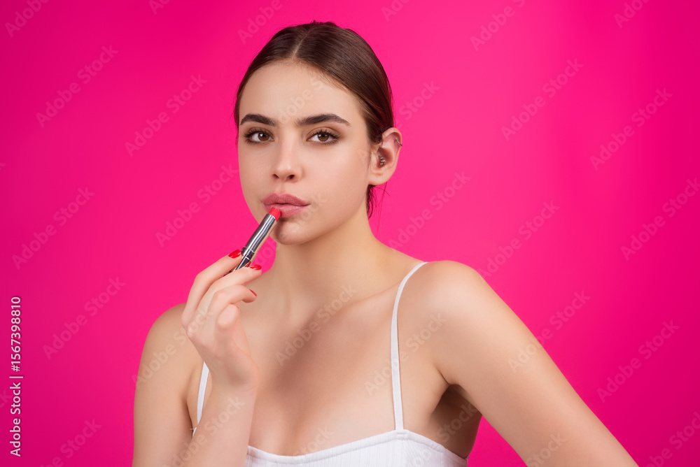 Lipstick, beauty and cosmetics. Beautiful woman applying lipstick on lips. Mockup for cosmetics, makeup. Lips color product, balm cosmetic on studio background. Lipstick, beauty and cosmetics. Beautiful woman applying lipstick on lips. Mockup for cosmetics, makeup. Lips color product, balm cosmetic on studio background.