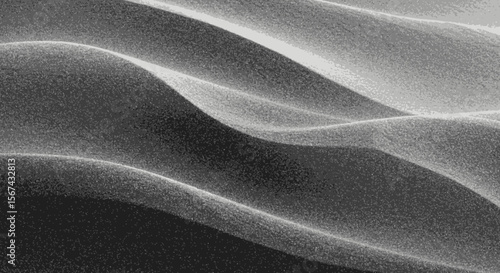 Abstract undulating sand dune texture with dramatic light and shadow patterns