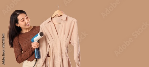 Asian woman with steamer an...