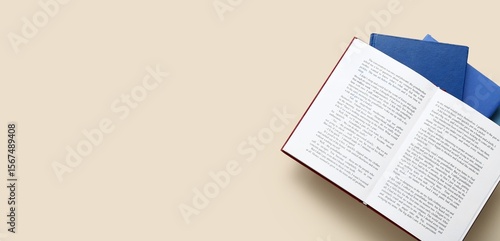 Stack of books on beige bac...