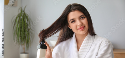 Pretty young woman with hai...