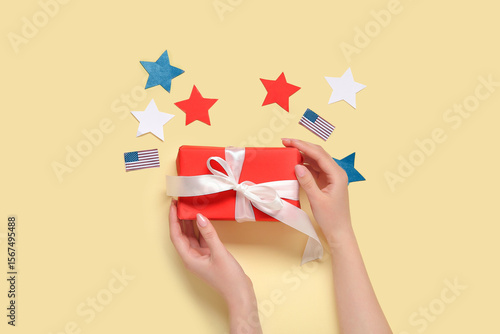 Woman holding gift box with...