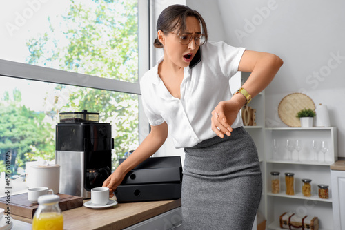 Deadline pressure and stress, busy woman checking watch while talking on phon...