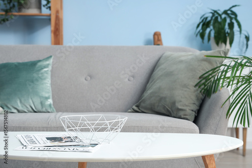 Stylish grey sofa in living...