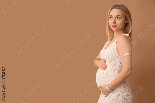 Young pregnant woman after ...