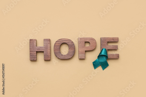 Teal ribbon and word HOPE o...