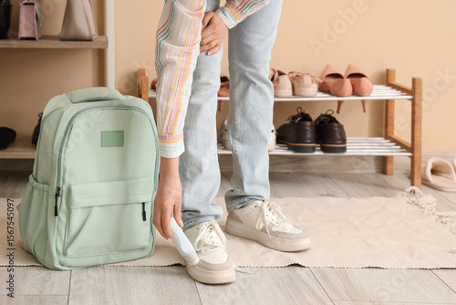Woman in stylish sneakers w...