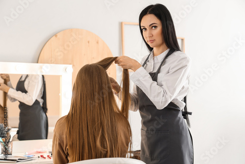Female hairdresser working ...