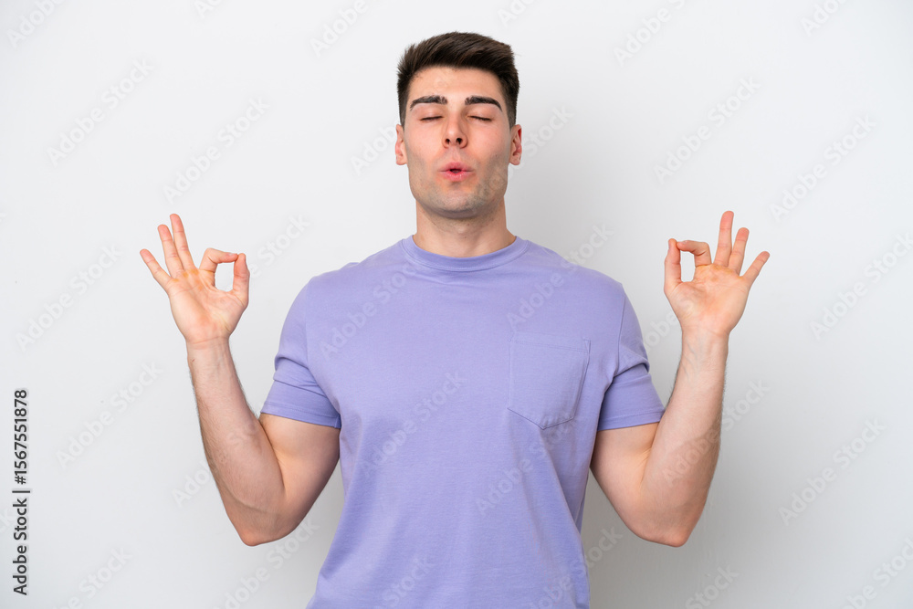 Young caucasian man isolated on white background in zen pose Young caucasian man isolated on white background in zen pose