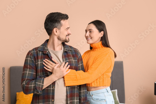 Young couple hugging in bed...