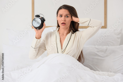 Overslept young woman with ...