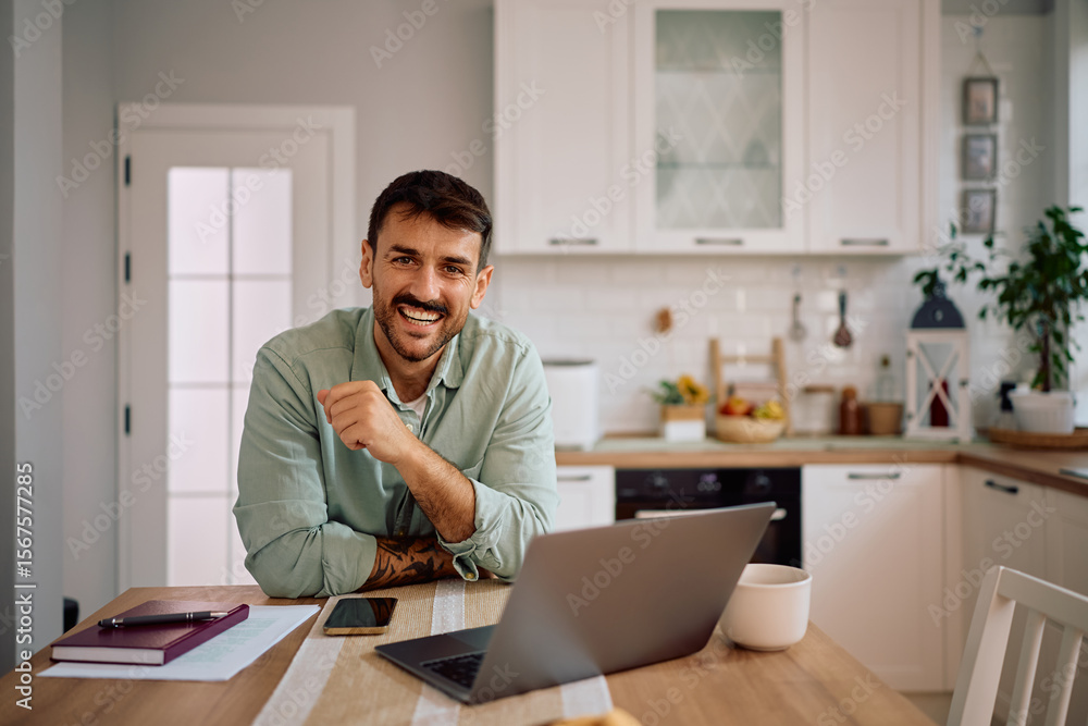 Happy freelancer working at home and looking at camera. Happy freelancer working at home and looking at camera.
