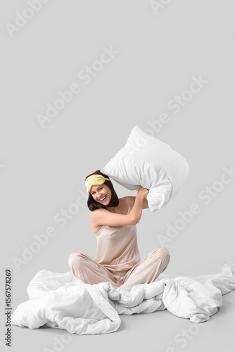 Young woman in pajamas with...