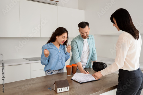 Female real estate agent se...